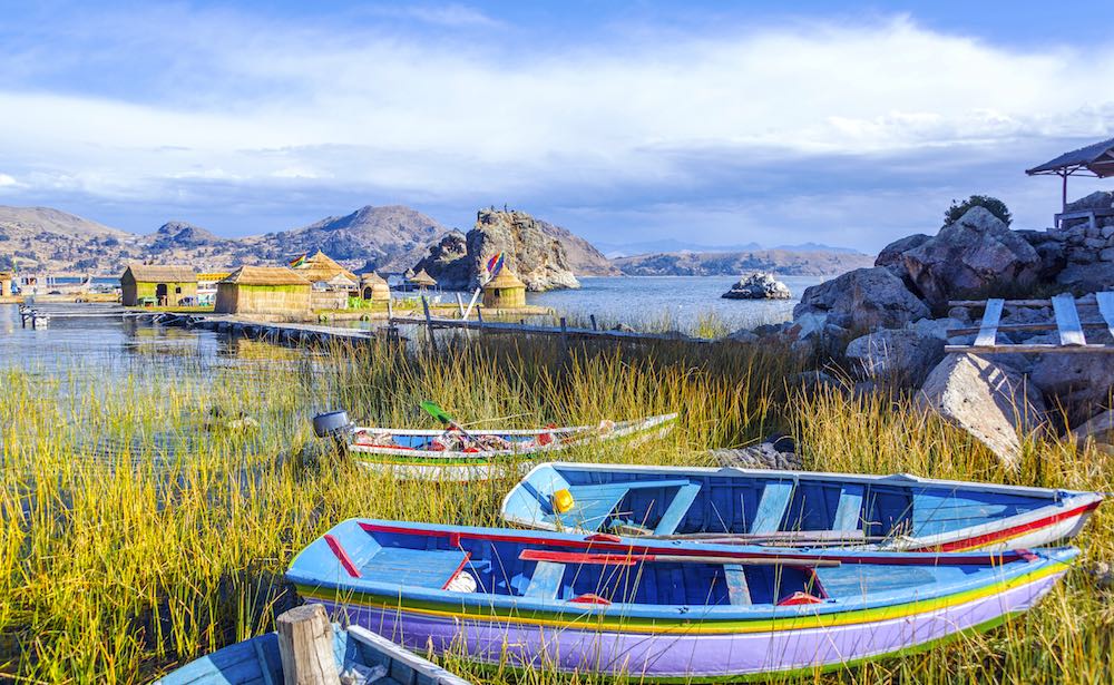 Colorful Boats Near Floating Islands On Lake Titicaca Near Copacabana, Bolivia